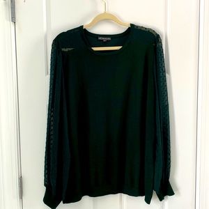 Adrianna Papell crew neck sweater in green with sheer sleeves and shoulders.